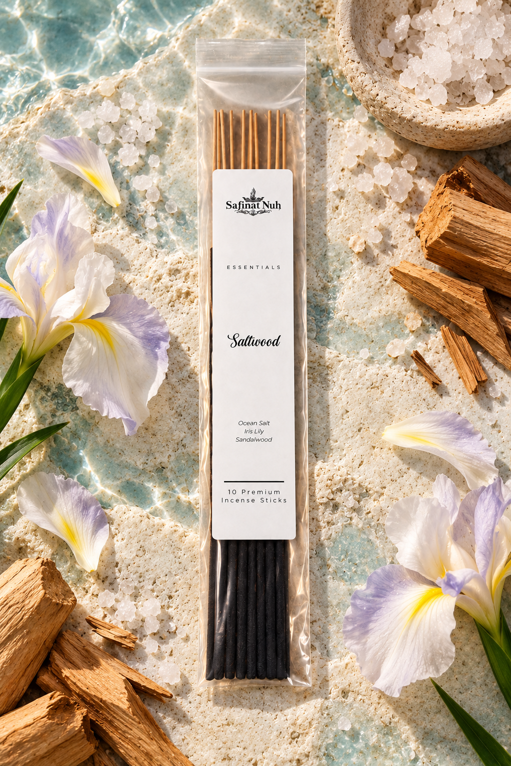 Saltwood incense sticks with ocean salt crystals, iris flowers and sandalwood on coastal stone
